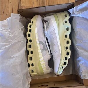 On Running White and Light Green Athletic Shoes